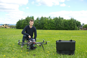 Image showing Engineer With UAV Helicopter in Park