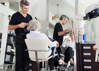 Image showing Hairdresser Styling Woman's Hair