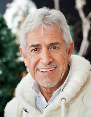 Image showing Senior Man In Christmas Store