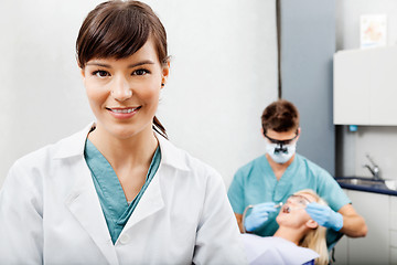 Image showing Female Assistant With Dentist Working In The Background