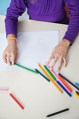 Image showing Girl With Color Pencils And Paper At Desk