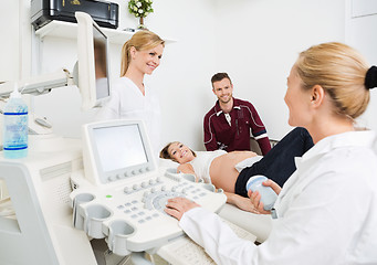 Image showing Gynecologists And Expectant Couple In Clinic