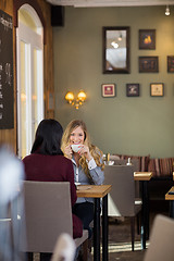 Image showing Young Woman Drinking Coffee With Female Friend