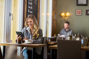 Image showing Pregnant Woman Using Digital Table In Cafe