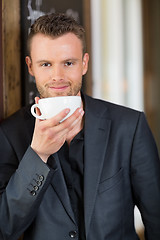 Image showing Confident Business Man Drinking Coffee