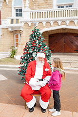 Image showing Sant Claus And Girl Looking At Each Other