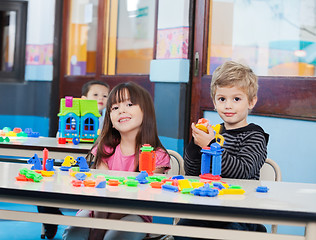 Image showing Little Children Playing With Blocks In Preschool