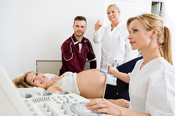 Image showing Couple And Doctors Looking At Ultrasound