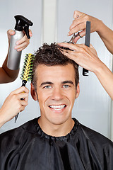 Image showing Client With Hairdressers Styling His Hair