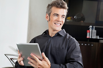 Image showing Male Client With Digital Tablet In Salon