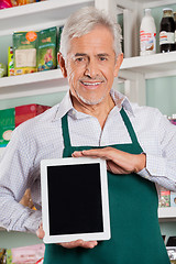 Image showing Male Owner Showing Digital Tablet In Store