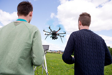 Image showing Pilot and Photographer Operating Photography Drone