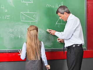 Image showing Professor Teaching Mathematics To Little Girl On Board