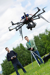 Image showing Engineers Operating UAV Octocopter in Park