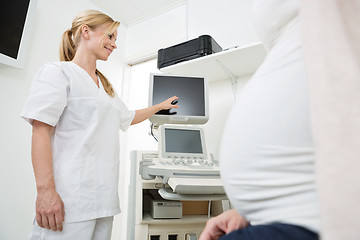 Image showing Gynecologist Showing Ultrasound Scan To Pregnant Woman