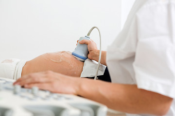 Image showing Doctor Examining Pregnant Belly By Ultrasonic Scan