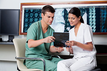 Image showing Medical Technicians Looking At X-ray