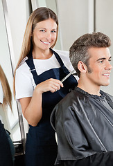 Image showing Hairdresser Cutting Client's Hair In Salon