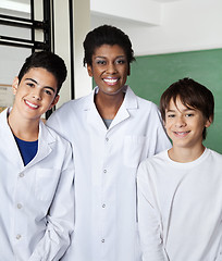 Image showing Teacher Standing With Male Schoolchildren In Classroom