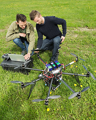 Image showing Technicians Discussing UAV