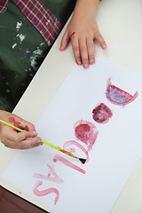 Image showing Boy Painting Name On Paper In Art Class