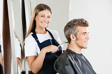 Image showing Hairstylist Giving Haircut To Customer