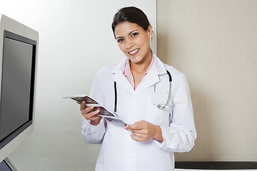 Image showing Female Radiologist Holding Sonography Print