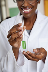 Image showing Teacher Holding Chemical Solution In Test Tube