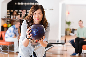 Image showing Young Woman Ready With Bowling Ball in Club