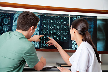 Image showing Medical Technicians Pointing At MRI X-ray