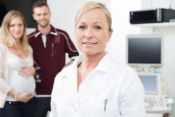 Image showing Obstetrician With Expectant Couple In Background