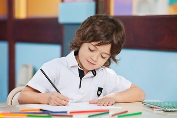 Image showing Boy With Sketch Pen Drawing In Kindergarten