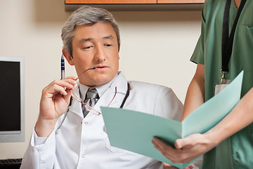 Image showing Doctor Reading Patient's File