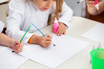 Image showing Girl Painting At Desk In Preschool