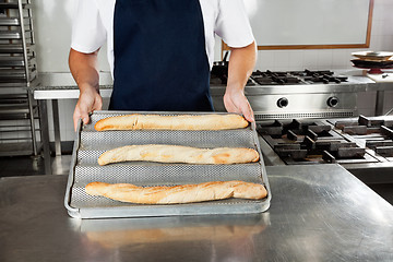 Image showing Male Chef Presenting Bread Loafs