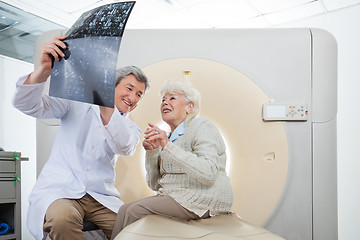 Image showing Radiologist With Patient Looking At CT Scan Results