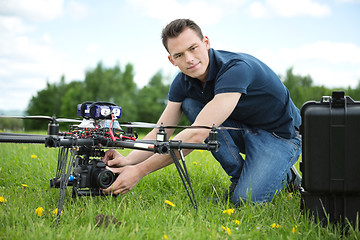 Image showing Engineer Setting Camera On Photography Drone