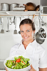 Image showing Female Chef Holding Bowl Of Salad
