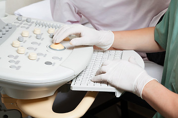 Image showing Technician Operating Ultrasound Machine