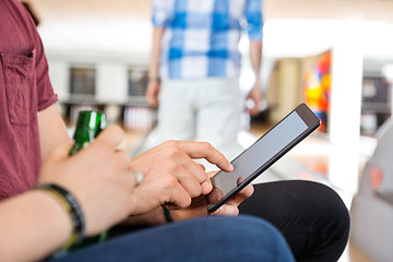 Image showing Couple Using Digital Tablet in Club