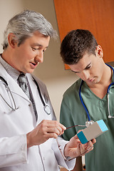 Image showing Medical Professionals Looking At Medicine Box