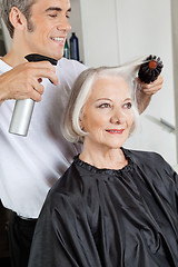 Image showing Hairstylist Setting Up Woman's Hair