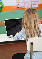 Image showing Little Girl Using Laptop In Preschool