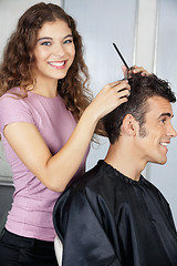 Image showing Happy Female Hairdresser Cutting Client's Hair