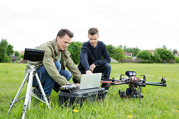 Image showing Technicians Using Laptop By Tripod And UAV