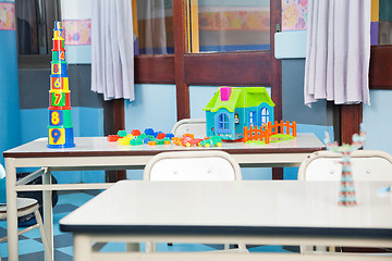 Image showing Construction Blocks And House On Desk