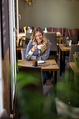 Image showing Woman Having Coffee At Cafe