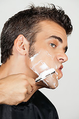 Image showing Mature Man Shaving His Face