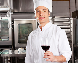 Image showing Young Chef Holding Wine Glass