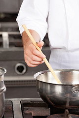 Image showing Male Chef preparing Food